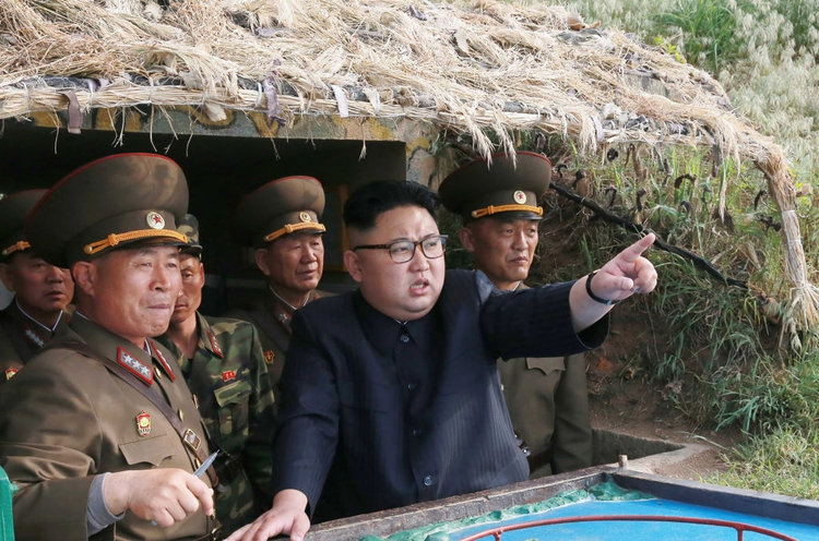 2017.09.17 North Korean leader Kim Jong Un, center, inspecting the defence detachment on Jangjae Islet and the Hero Defence Detachment on Mu Islet STR-AFP-Getty images LNJCEN2X2RFDPIOSZ4