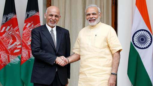 Afghan President Ashraf Ghani and India's PM Narendra Modi pose for the media outside Hyderabad House in Delhi