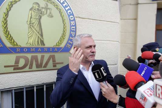 Social Democrat Party leader Liviu Dragnea gestures after leaving the Romanian anti-corruption prosecutors headquarters in Bucharest