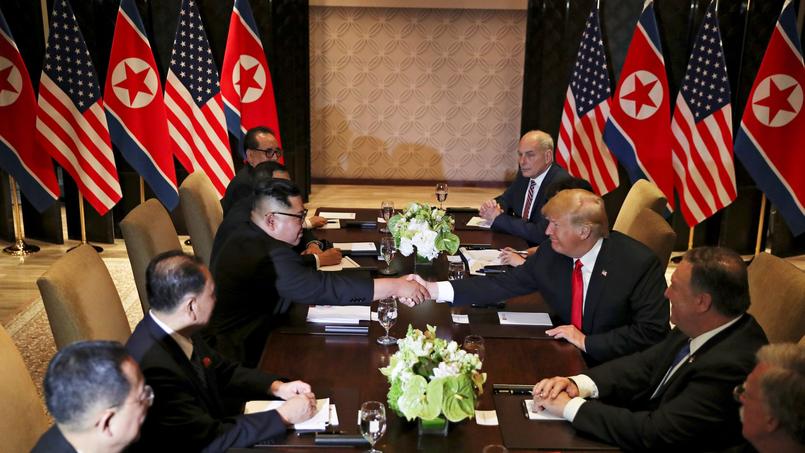 U.S. President Donald Trump shakes hands with North Korea's leader Kim Jong Un before their expanded bilateral meeting in Singapore
