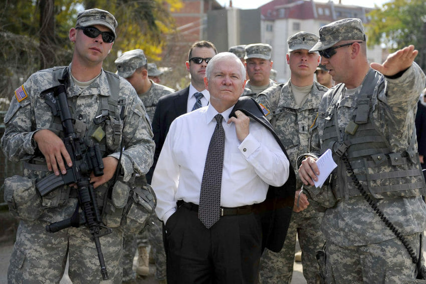 USA Robert-Gates-with-troops-850x567Then-Secretary of Defense Robert Gates during a 2008 visit to Kosovo with U.S. Army troops on foot patrol in the town of Gnjilane. (The U.S. Army- CC