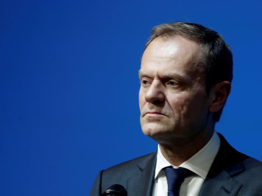 President of the European Council Tusk listens during a news conference in Tallinn