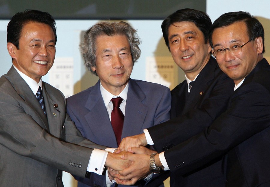 Japan's Shinzo Abe (2nd R), the newly elected as the president o