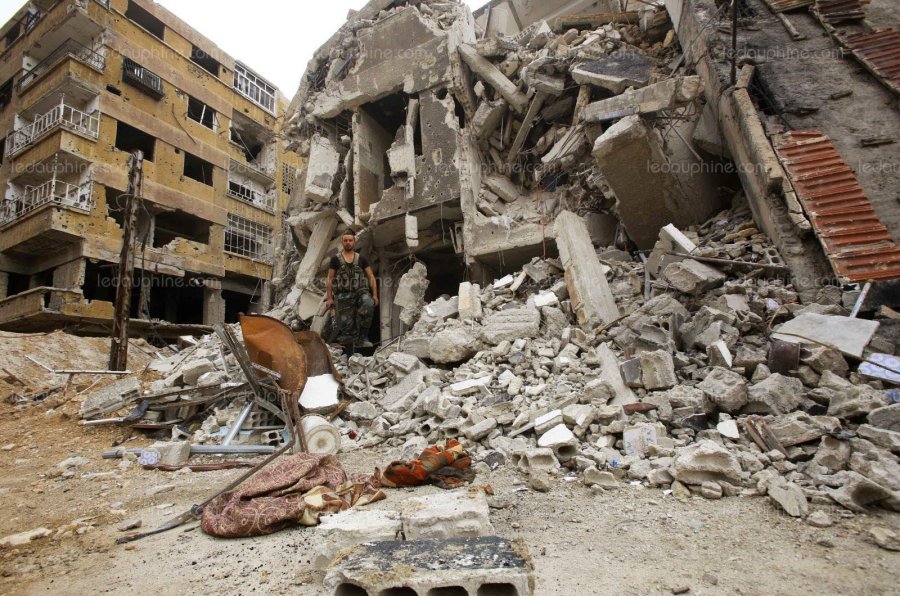 douma-etait-le-dernier-bastion-rebelle-dans-la-ghouta-orientale-quelques-jours-apres-l-attaque-chimique-presumee-les-opposants-au-regime-ont-accepte-de-quitter-les-lieux-photo-youssef-karwashan-afp-1523635036