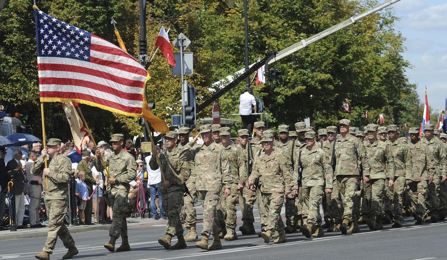 A U.S. Army unit marches during a yearly military parade celebrating the Polish Army Day, in Warsaw, Poland, Tuesday, Aug. 15, 2017. (AP PhotoAlik Keplicz)