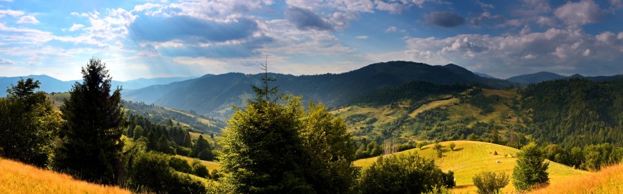 Ukraine-nature-landscape-trees-grass-mountains-clouds-sun_3840x1200